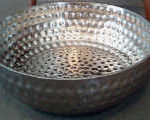 Large metal bowl for soaking feet.