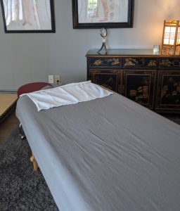 Massage table in treatment room.